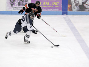 Souths Alex Demaio, No. 22, skates past Norths Tom Terranova.